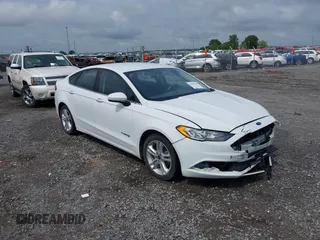 2018 Ford Fusion SE z VIN 3FA6P0LU8JR147243, wystawiony jako IAAI lot #42070708 z przebiegiem 128 542 mil mil oraz . Historia ofert i sprzedaży dostępna na DreamBid. Obrazek 1.