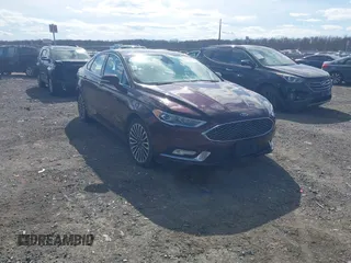 2017 Ford Fusion Titanium z VIN 3FA6P0SU9HR121813, wystawiony jako IAAI lot #41681808 z przebiegiem 163 000 mil mil oraz . Historia ofert i sprzedaży dostępna na DreamBid. Obrazek 1.
