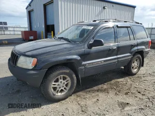1999 Jeep Grand Cherokee Limited with VIN 1J4GW68N4XC679841, listed as a Copart auction lot 59760015 with 155,366 mi miles and Salvage title. Bid and sale history available at DreamBid. Image 1.