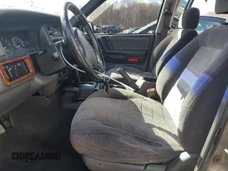 1997 Jeep Grand Cherokee Laredo with VIN 1J4GZ58SXVC569171, listed as a Copart auction lot 45657745 with 101,648 mi miles and Salvage Title. Bid and sale history available at carsss.com. Image 7.