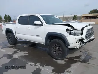 2016 Toyota Tacoma SR5 z VIN 3TMAZ5CN5GM023733, wystawiony jako IAAI lot #41561502 z przebiegiem 151 208 mil mil oraz . Historia ofert i sprzedaży dostępna na DreamBid. Obrazek 1.