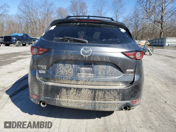 2018 Mazda CX-5 Grand Touring with VIN JM3KFBDM2J0407164, listed as a Copart auction lot 50080345 with 126,464 mi miles and Salvage title. Bid and sale history available at DreamBid. Image 6.