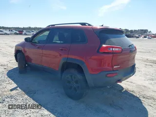 2015 Jeep Cherokee Trailhawk with VIN 1C4PJMBS1FW640483, listed as a IAAI auction lot 41883688 with 103,589 mi miles. Bid and sale history available at carsss.com. Image 3.