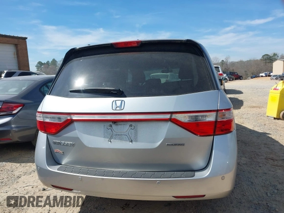 2012 Honda Odyssey Touring with VIN 5FNRL5H92CB108690, listed as a IAAI auction lot 41826580 with 150,327 mi miles and . Bid and sale history available at DreamBid. Image 16.