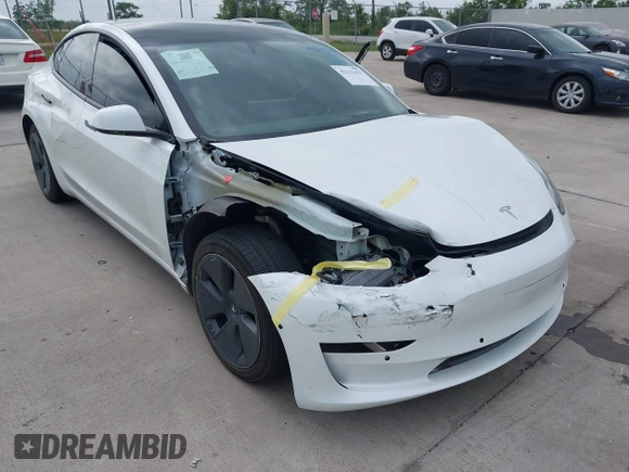 2022 Tesla Model 3 Long Range z VIN 5YJ3E1EBXNF246318, wystawiony jako IAAI lot #42131425 z przebiegiem 32 096 mil mil oraz . Historia ofert i sprzedaży dostępna na DreamBid. Obrazek 6.