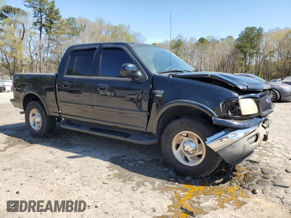 2003 Ford F-150 XLT with VIN 1FTRW08L63KB47470, listed as a Copart auction lot 50400055 with 223,859 mi miles and Salvage Title. Bid and sale history available at carsss.com. Image 4.