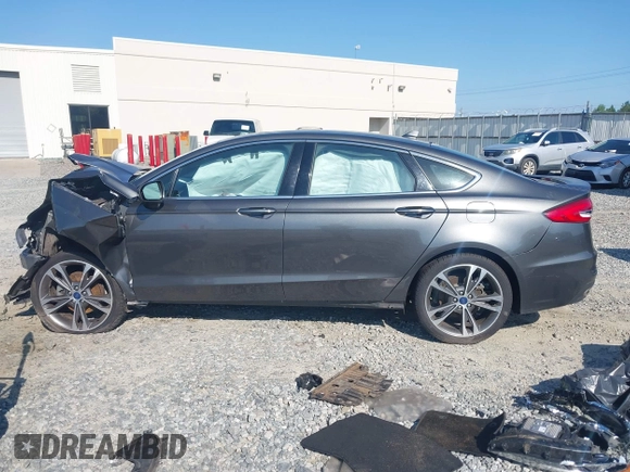2020 Ford Fusion Titanium with VIN 3FA6P0K91LR175109, listed as a IAAI auction lot 42267532 with 75,000 mi miles and . Bid and sale history available at DreamBid. Image 14.