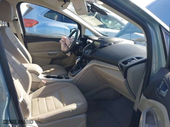 2013 Ford C-Max Hybrid SEL with VIN 1FADP5BUXDL521814, listed as a IAAI auction lot 41944352 with 130,999 mi miles. Bid and sale history available at carsss.com. Image 5.