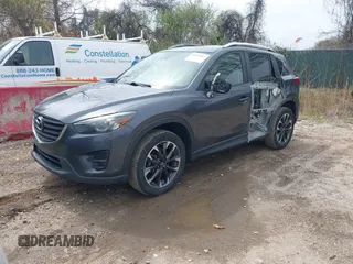 2016 Mazda CX-5 Grand Touring with VIN JM3KE4DYXG0830150, listed as a IAAI auction lot 41961007 with 142,570 mi miles and . Bid and sale history available at DreamBid. Image 2.