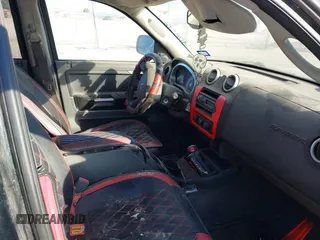 2006 Mitsubishi Raider Duro Cross with VIN 1Z7HT38N66S580223, listed as a IAAI auction lot 41285120 with 83,421 mi miles. Bid and sale history available at carsss.com. Image 5.
