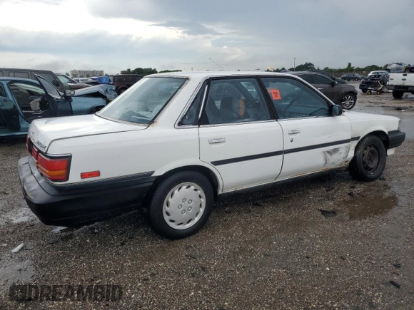 1991 Toyota Camry z VIN JT2SV21E2M3435406, wystawiony jako Copart lot #74958494 z przebiegiem 127 580 mil mil oraz Szkoda całkowita • Salvage title. Historia ofert i sprzedaży dostępna na DreamBid. Obrazek 3.