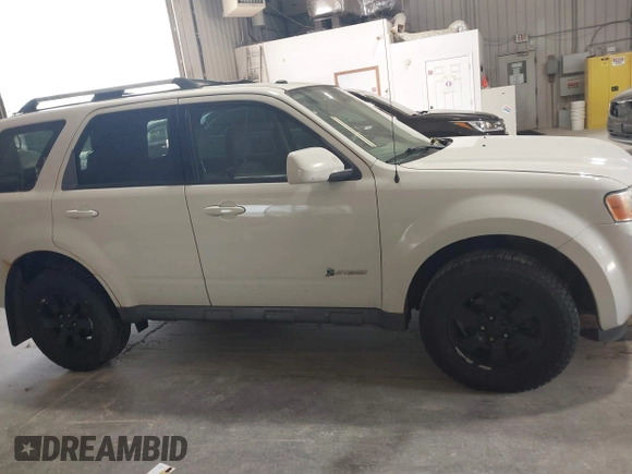 2009 Ford Escape Hybrid z VIN 1FMCU59329KB01081, wystawiony jako IAAI lot #42557114 z przebiegiem 206 972 mil mil oraz . Historia ofert i sprzedaży dostępna na DreamBid. Obrazek 13.