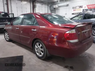 2005 Toyota Camry LE with VIN 4T1BF30KX5U099450, listed as a IAAI auction lot 41670099 with Not Provided miles and . Bid and sale history available at DreamBid. Image 3.