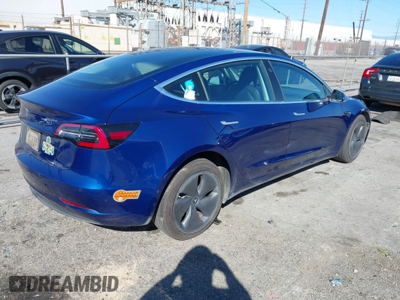 2019 Tesla Model 3 Mid Range with VIN 5YJ3E1EA8KF436086, listed as a IAAI auction lot 41682093 with 70,332 mi miles and . Bid and sale history available at DreamBid. Image 4.