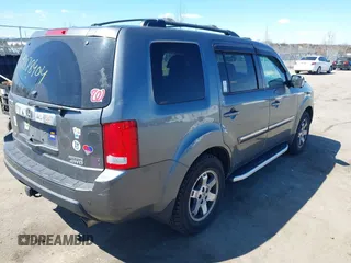 2011 Honda Pilot Touring with VIN 5FNYF4H95BB090892, listed as a IAAI auction lot 41878404 with 131,757 mi miles. Bid and sale history available at carsss.com. Image 4.