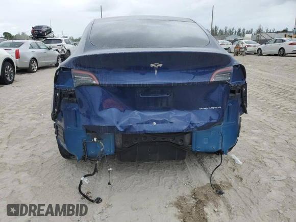 2023 Tesla Model Y Long Range z VIN 7SAYGDEE5PF787794, wystawiony jako Copart lot #55212605 z przebiegiem 30 277 mil mil oraz Szkoda całkowita • Salvage title. Historia ofert i sprzedaży dostępna na DreamBid. Obrazek 6.