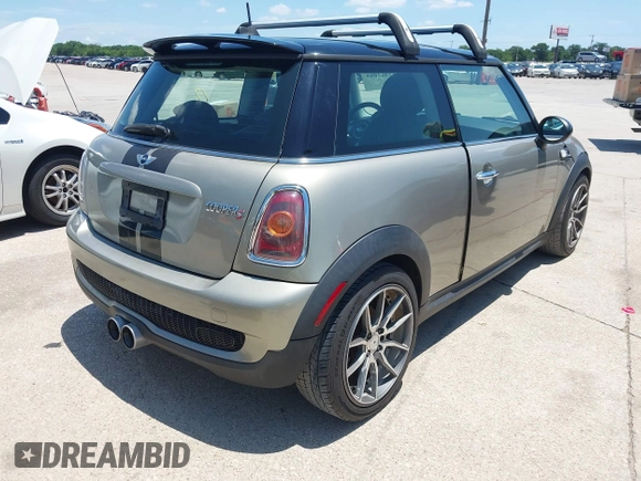 2009 MINI Hardtop S with VIN WMWMF73529TX40576, listed as a IAAI auction lot 42462085 with 77,936 mi miles and . Bid and sale history available at DreamBid. Image 4.