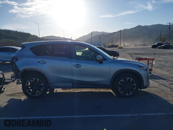 2016 Mazda CX-5 Grand Touring z VIN JM3KE2DY8G0709573, wystawiony jako IAAI lot #42021005 z przebiegiem 113 941 mil mil oraz . Historia ofert i sprzedaży dostępna na DreamBid. Obrazek 14.