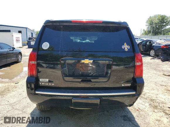 2018 Chevrolet Tahoe Premier with VIN 1GNSKCKC1JR133625, listed as a Copart auction lot 54900974 with 130,921 mi miles and Salvage title. Bid and sale history available at DreamBid. Image 6.