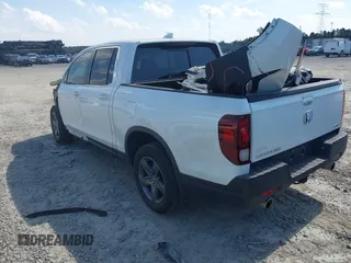 2022 Honda Ridgeline RTL with VIN 5FPYK3F51NB025152, listed as a IAAI auction lot 42325957 with 54,632 mi miles and . Bid and sale history available at DreamBid. Image 3.