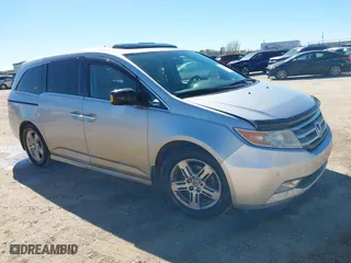 2013 Honda Odyssey Touring with VIN 5FNRL5H93DB076463, listed as a IAAI auction lot 41819994 with 188,911 mi miles. Bid and sale history available at carsss.com. Image 1.