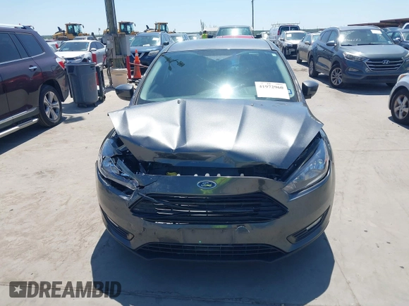 2018 Ford Focus SE with VIN 1FADP3FE3JL204220, listed as a IAAI auction lot 41972960 with 62,682 mi miles and . Bid and sale history available at DreamBid. Image 12.