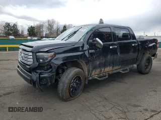 2014 Toyota Tundra Platinum with VIN 5TFAW5F18EX399237, listed as a Copart auction lot 51186755 with 105,547 mi miles and Salvage title. Bid and sale history available at DreamBid. Image 1.