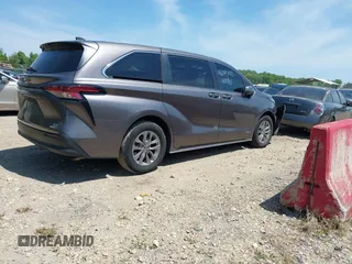 2021 Toyota Sienna LE with VIN 5TDKSKFC4MS004345, listed as a IAAI auction lot 42145140 with 103,544 mi miles and . Bid and sale history available at DreamBid. Image 4.