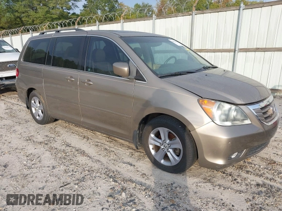 2010 Honda Odyssey Touring with VIN 5FNRL3H9XAB094779, listed as a IAAI auction lot 40412812 with 145,533 mi miles. Bid and sale history available at carsss.com. Image 1.