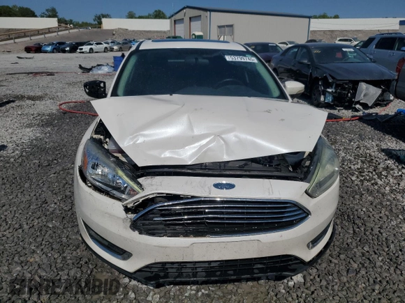 2016 Ford Focus Titanium z VIN 1FADP3J25GL201003, wystawiony jako Copart lot #53799745 z przebiegiem 194 055 mil mil oraz Szkoda całkowita • Salvage title. Historia ofert i sprzedaży dostępna na DreamBid. Obrazek 5.