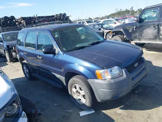 2003 Ford Escape XLS Popular with VIN 1FMYU02133KA02990, listed as a IAAI auction lot 41803174 with 140,792 mi miles. Bid and sale history available at carsss.com. Image 12.