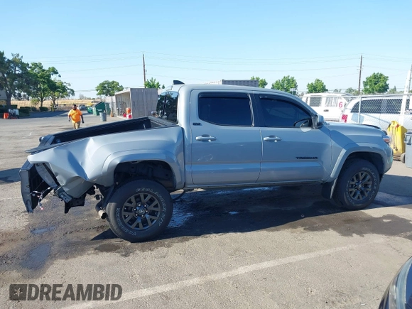 2021 Toyota Tacoma SR5 with VIN 5TFAZ5CN7MX101810, listed as a IAAI auction lot 42454418 with 58,930 mi miles and . Bid and sale history available at DreamBid. Image 14.