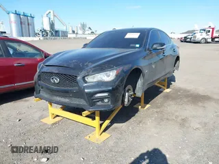 2015 Infiniti Q50 Premium with VIN JN1BV7AR6FM393586, listed as a IAAI auction lot 41683059 with 125,991 mi miles. Bid and sale history available at carsss.com. Image 2.