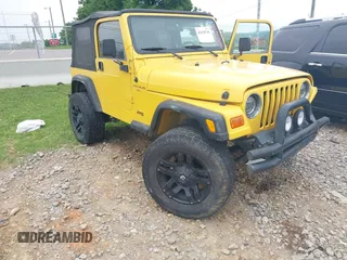 2001 Jeep Wrangler Sport z VIN 1J4FA49S61P309297, wystawiony jako IAAI lot #42436741 z przebiegiem 162 774 mil mil oraz . Historia ofert i sprzedaży dostępna na DreamBid. Obrazek 1.