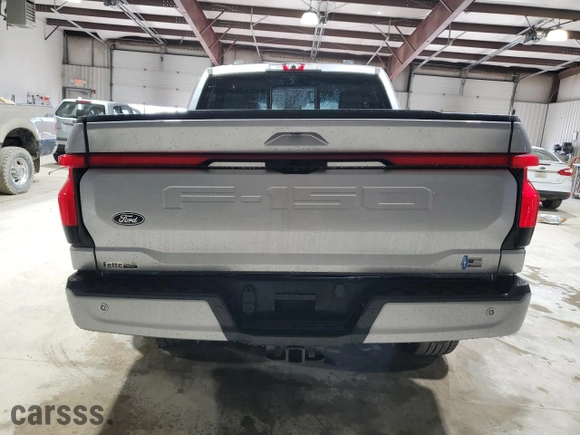 2024 Ford F-150 Lightning LARIAT with VIN 1FT6W5L74RWG04451, listed as a Copart auction lot 86058664 with 2,232 mi miles and Salvage Title. Bid and sale history available at carsss.com. Image 6.
