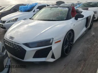 2020 Audi R8 Spyder performance z VIN WUA4BCFX3L7901606, wystawiony jako Copart lot #75199024 z przebiegiem Nie podano mil oraz Nie do naprawy. Historia ofert i sprzedaży dostępna na DreamBid. Obrazek 1.