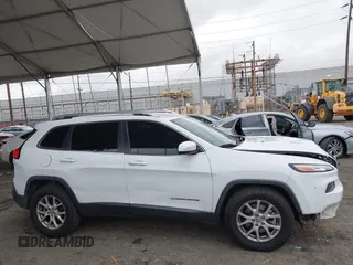 2015 Jeep Cherokee Latitude with VIN 1C4PJLCB5FW642701, listed as a IAAI auction lot 42063262 with 142,501 mi miles and . Bid and sale history available at carsss.com. Image 13.