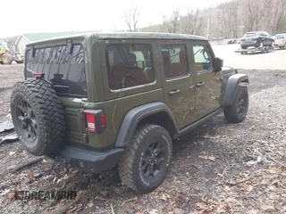 2021 Jeep Wrangler Unlimited Willys with VIN 1C4HJXDNXMW579595, listed as a IAAI auction lot 41930989 with 32,148 mi miles and . Bid and sale history available at DreamBid. Image 4.