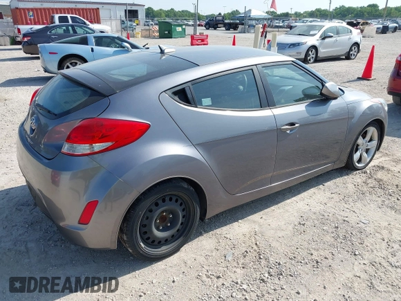 2013 Hyundai Veloster w/Gray Int with VIN KMHTC6AD9DU128725, listed as a IAAI auction lot 42648356 with 168,109 mi miles and . Bid and sale history available at DreamBid. Image 4.