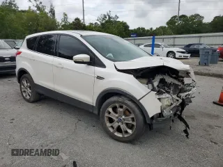 2013 Ford Escape SEL z VIN 1FMCU9HX4DUB05173, wystawiony jako Copart lot #57918125 z przebiegiem 197 195 mil mil oraz Szkoda całkowita • Salvage title. Historia ofert i sprzedaży dostępna na DreamBid. Obrazek 4.