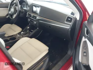 2016 Mazda CX-5 Grand Touring with VIN JM3KE4DY3G0688062, listed as a IAAI auction lot 42025169 with 59,867 mi miles and . Bid and sale history available at carsss.com. Image 5.