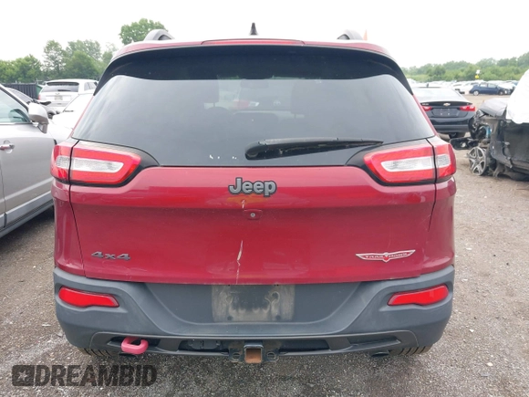 2015 Jeep Cherokee Trailhawk with VIN 1C4PJMBS6FW575517, listed as a IAAI auction lot 42661199 with 299,166 mi miles and . Bid and sale history available at DreamBid. Image 16.