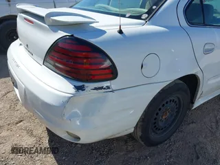 2005 Pontiac Grand Am SE with VIN 1G2NE52E05M215976, listed as a IAAI auction lot 42025657 with 220,418 mi miles. Bid and sale history available at carsss.com. Image 6.
