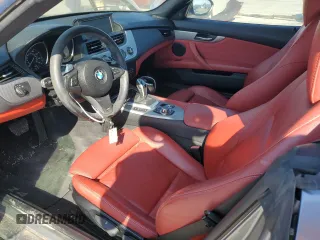 2011 BMW Z4 sDrive35i with VIN WBALM7C59BE384283, listed as a Copart auction lot 77204914 with 87,016 mi miles and Salvage Title. Bid and sale history available at carsss.com. Image 8.