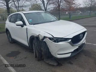 2017 Mazda CX-5 Touring with VIN JM3KFACL5H0189296, listed as a IAAI auction lot 42042328 with 60,208 mi miles and . Bid and sale history available at carsss.com. Image 1.