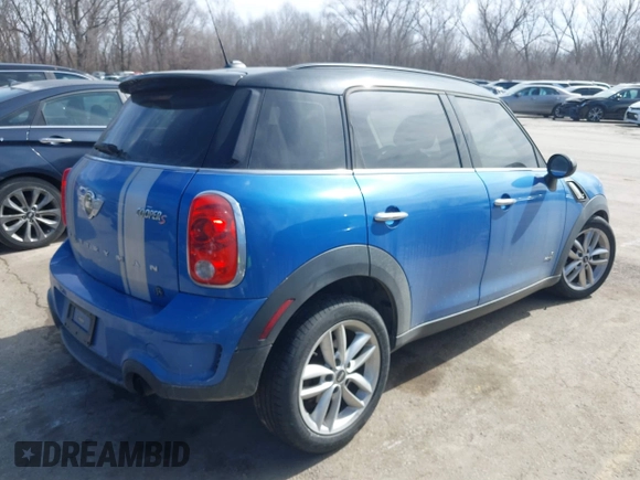 2014 MINI Countryman S with VIN WMWZC5C54EWM17299, listed as a IAAI auction lot 41655370 with 104,264 mi miles and . Bid and sale history available at DreamBid. Image 4.