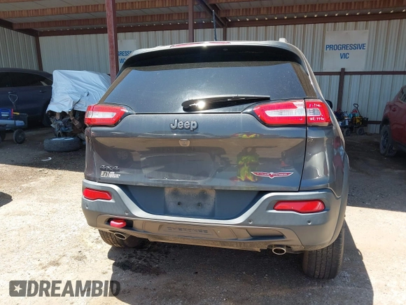 2016 Jeep Cherokee Trailhawk z VIN 1C4PJMBSXGW123829, wystawiony jako IAAI lot #42316140 z przebiegiem 77 730 mil mil oraz . Historia ofert i sprzedaży dostępna na DreamBid. Obrazek 16.