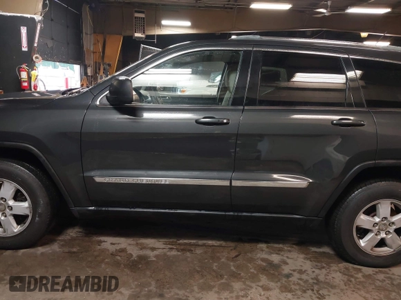 2011 Jeep Grand Cherokee 70th Anniversary with VIN 1J4RR4GG3BC566690, listed as a IAAI auction lot 41810545 with 173,886 mi miles. Bid and sale history available at carsss.com. Image 14.