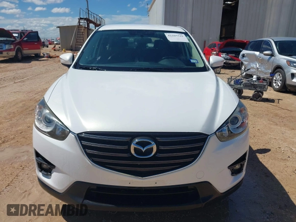 2016 Mazda CX-5 Touring z VIN JM3KE2CY0G0840918, wystawiony jako IAAI lot #42205529 z przebiegiem 74 515 mil mil oraz . Historia ofert i sprzedaży dostępna na DreamBid. Obrazek 12.