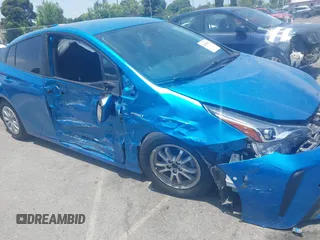 2021 Toyota Prius L Eco with VIN JTDKAMFUXM3134462, listed as a IAAI auction lot 42450931 with 89,239 mi miles and . Bid and sale history available at DreamBid. Image 6.